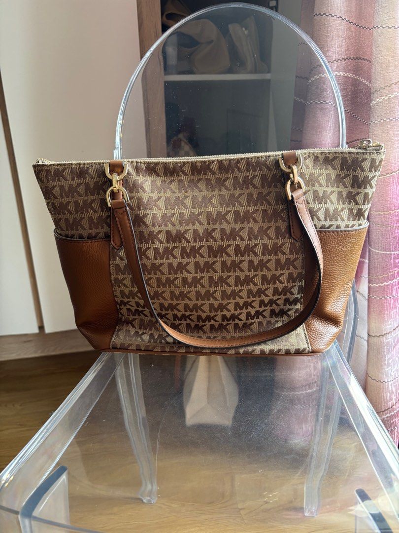 Michael Kors Bedford Large Tote Bag (Category: Luxury Bags & Wallets) located in Las Pinas. Submitted by itskat.cruz (Listing ID 1413074827, Image 2). Description: - Authentic Michael Kors Bedford Large tote bag (used once) - Brown and beige logo print coated canvas and leather - Brown leather accents - Secure zip closure - Interior lined with matching fabric - Multiple pockets inside - Comfortable double handles - Elegant gold-tone MK logo charm
