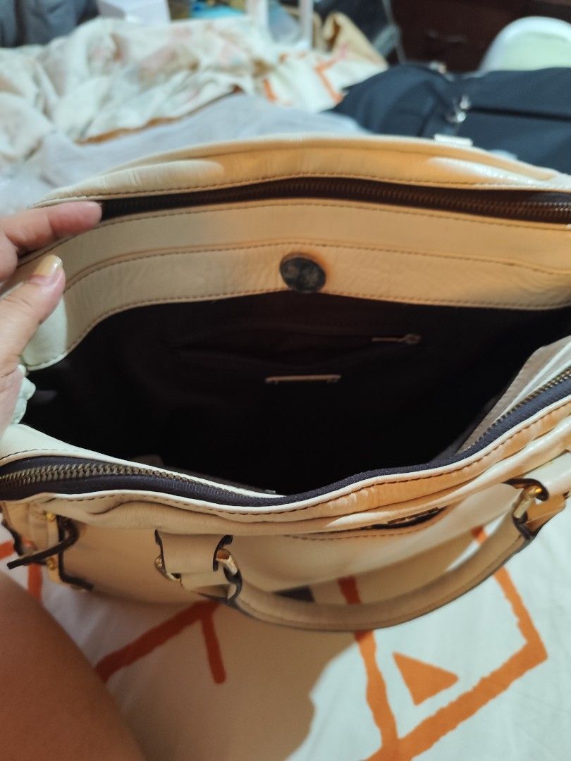 Miu Miu offwhite Handbag (Category: Luxury Bags & Wallets) located in Makati City. Submitted by call_me_biggy (Listing ID 1413104754, Image 2). Description: - Off white Miu Miu handbag - light gold tone hardware - Dual top handles - Zip closure - Exterior zip pockets - Main compartment with brand label - provided sling but not the same brand - Classic shape - Made of leather - Authenticity not guaranteed.
