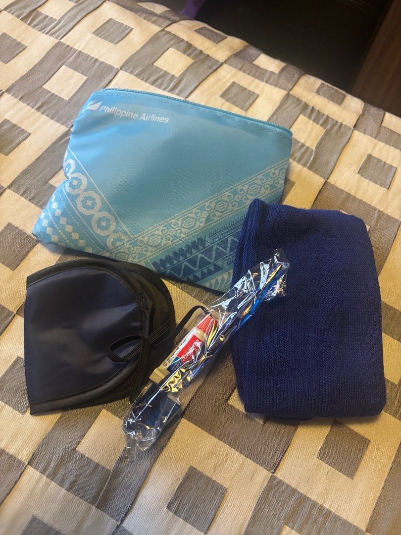 Philippine Airlines Travel Kit (Category: Travel Essentials & Accessories) located in Pasig City. Submitted by royski72 (Listing ID 1413098193, Image 1). Description: - Includes a light blue pouch with a unique design and Philippine Airlines logo. - Comes with a comfortable eye mask. - Features navy blue socks. - Includes a brand new toothbrush in its original packaging. - Ideal for long flights and travel..