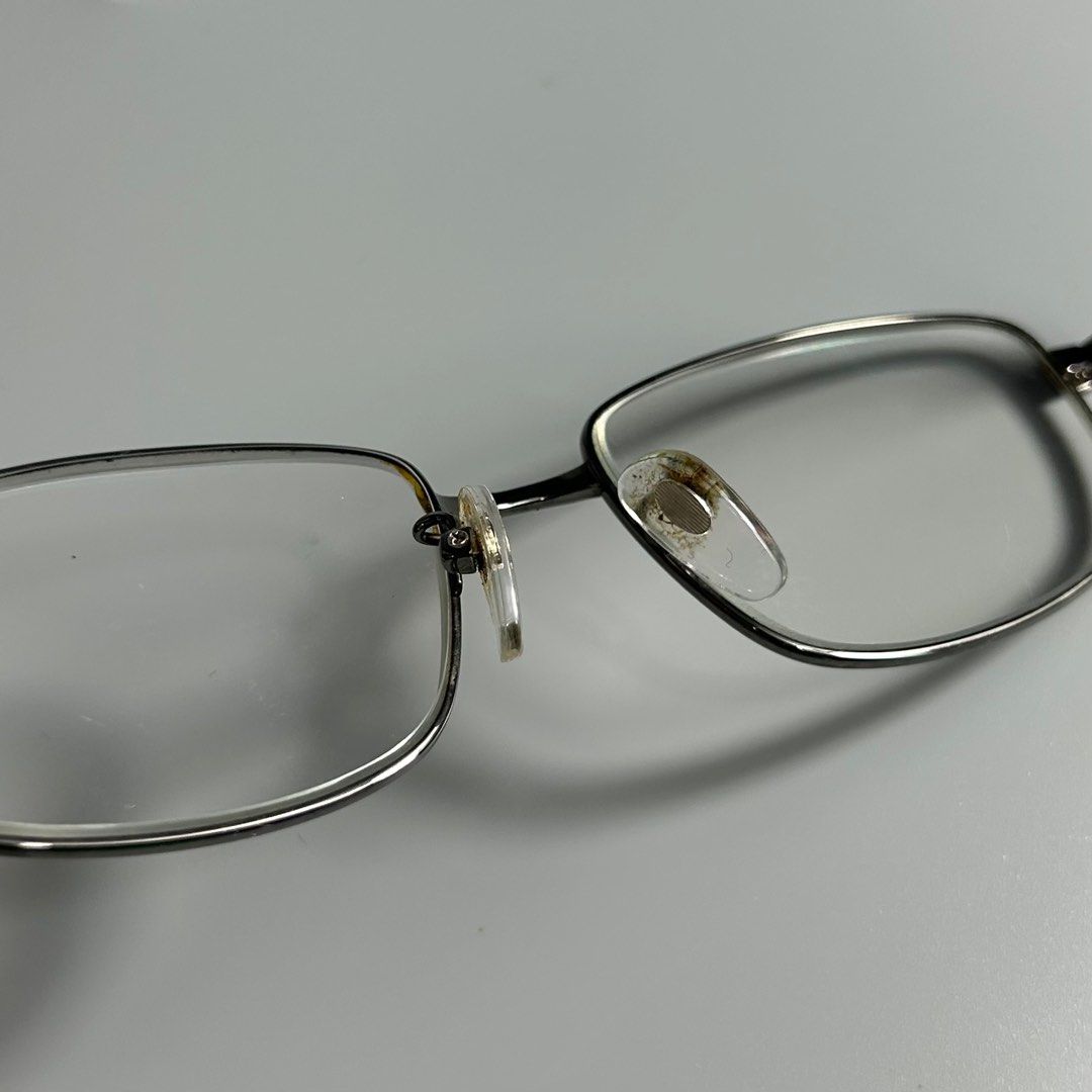 P-ixel II Titanium Eyeglasses (Category: Sunglasses & Eyewear) located in Cavite. Submitted by datsoretro (Listing ID 1413213669, Image 3). Description: - Rectangular frame with a sleek silver finish. - Black temples with "P-ixel II 114" and "Titan 51[]142" markings. - Clear lenses. - Comfortable nose pads. - Modern design suitable for daily wear..