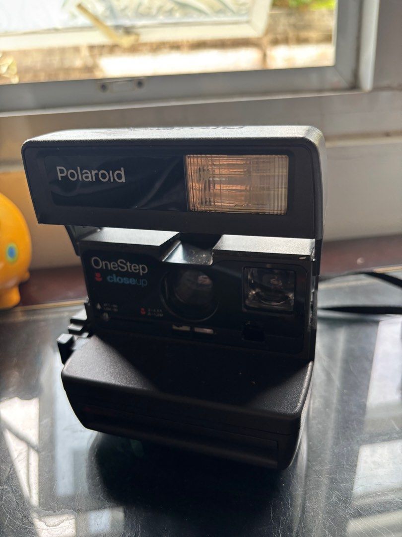 Polaroid OneStep Close-up Instant Camera (Category: Cameras) located in Pasay City. Submitted by cabg0331 (Listing ID 1413088156, Image 1). Description: - working just needs new film - Polaroid OneStep Close-up camera - Built-in flash - Comes with a strap - Instant photo printing capability - Features the iconic Polaroid logo - negotiable .