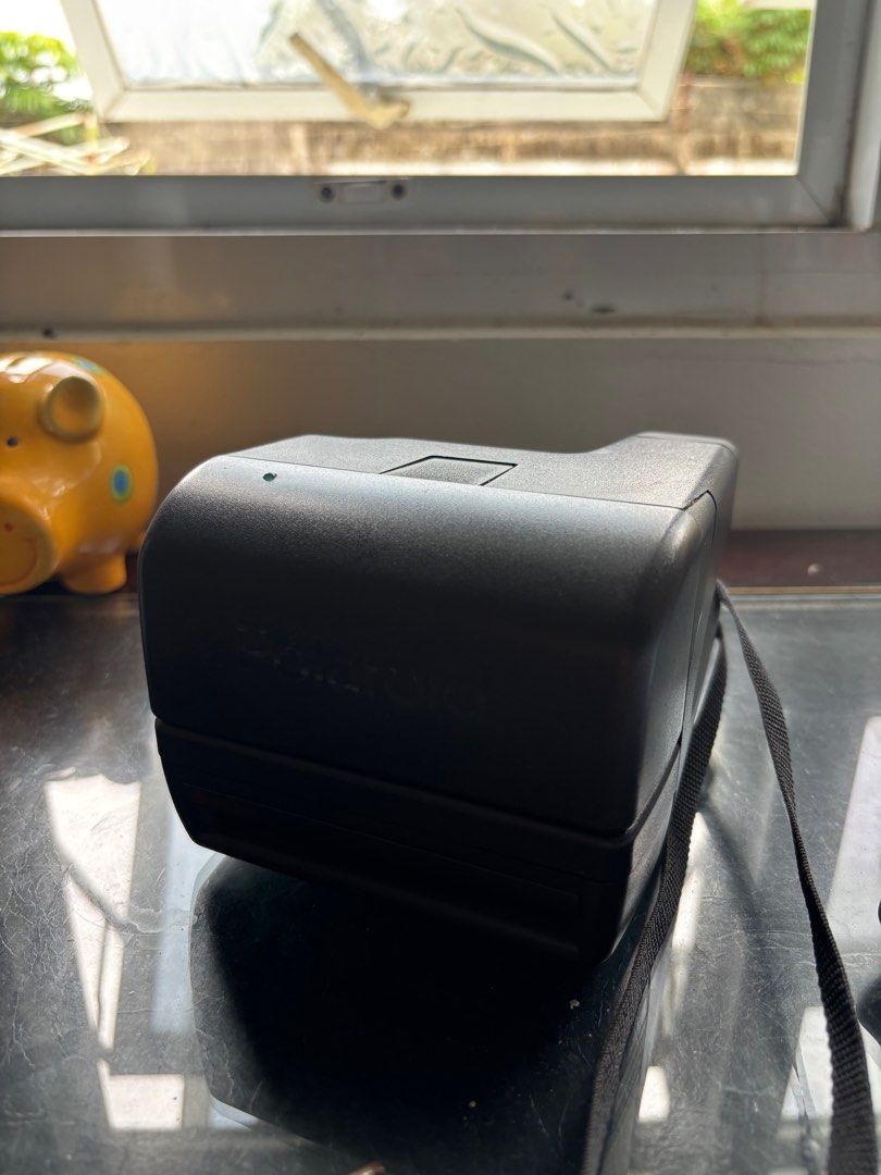 Polaroid OneStep Close-up Instant Camera (Category: Cameras) located in Pasay City. Submitted by cabg0331 (Listing ID 1413088156, Image 2). Description: - working just needs new film - Polaroid OneStep Close-up camera - Built-in flash - Comes with a strap - Instant photo printing capability - Features the iconic Polaroid logo - negotiable .