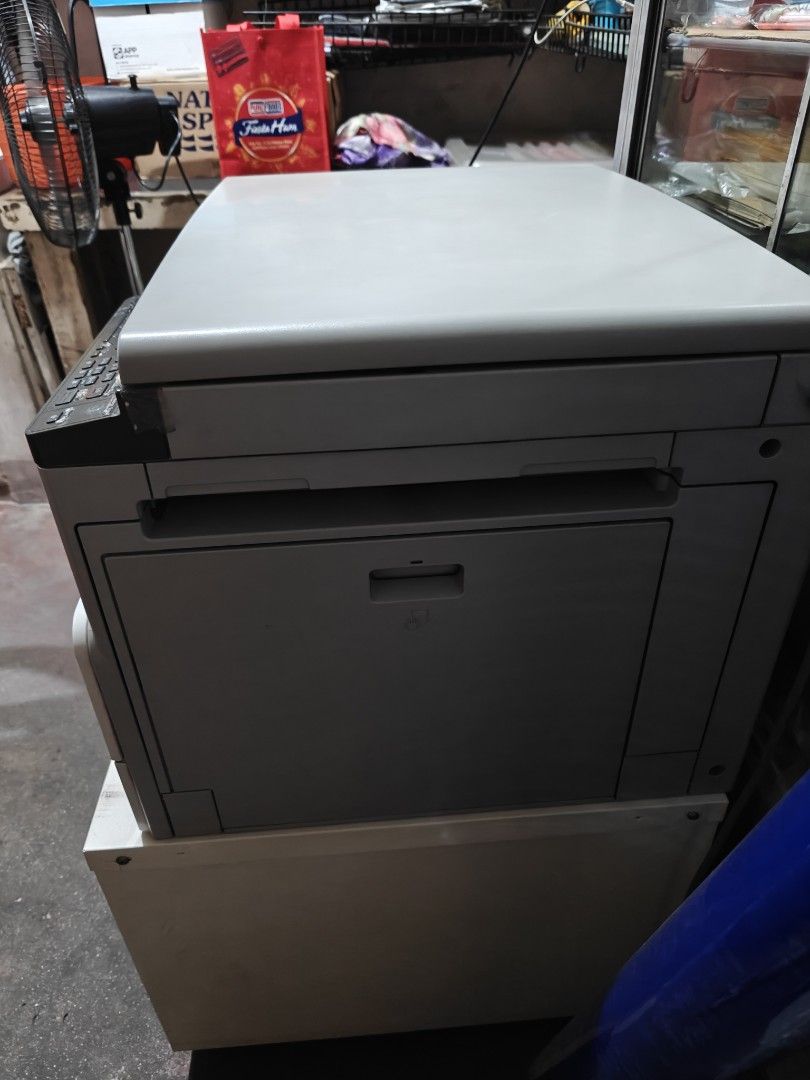 Ricoh Aficio MP 2014 Multifunction Printer (Category: Printers, Scanners & Copiers) located in Manila. Submitted by akintwo023 (Listing ID 1413126221, Image 3). Description: - Ricoh Aficio MP 2014 Multifunction Printer - Scanner and copier functions - Includes paper tray - Features a control panel - Power button and USB port - Flatbed model - Good working condition - Clear photocopy result - Bought Brand-new - Ready to use - included table cabine