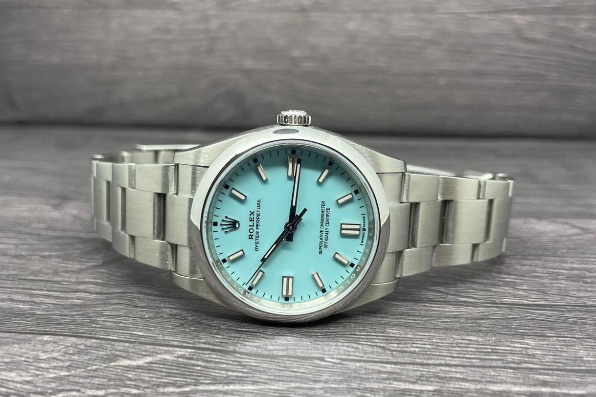 [Full Set] [2021] Rolex Oyster Perpetual Turquoise "Tiffany" 126000 [36mm] (Category: Watches) located in Singapore. Submitted by vsy07 (Listing ID 1413052843, Image 1). Description: Oyster Perpetual 126000 Turquoise "Tiffany" Worn a few times, in general good condition. Scratch at bezel that is visible under 3x+ loupe at 4pm, no other known damages/dents/etc. Probably hairline scratches at the buckles. Papers: Yes (2021 Set) Box: Yes Full set wi