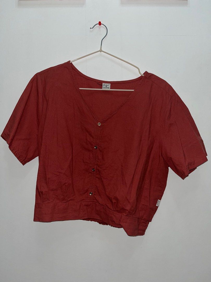 Rust-colored Button-down Top (Category: Blouses) located in Las Pinas. Submitted by leimooonade (Listing ID 1413147556, Image 1). Description: Rust-colored top features a V-neckline and short sleeves. It has a button-down front and a gathered hem. It is a versatile piece that can be dressed up or down. Cropped Top.