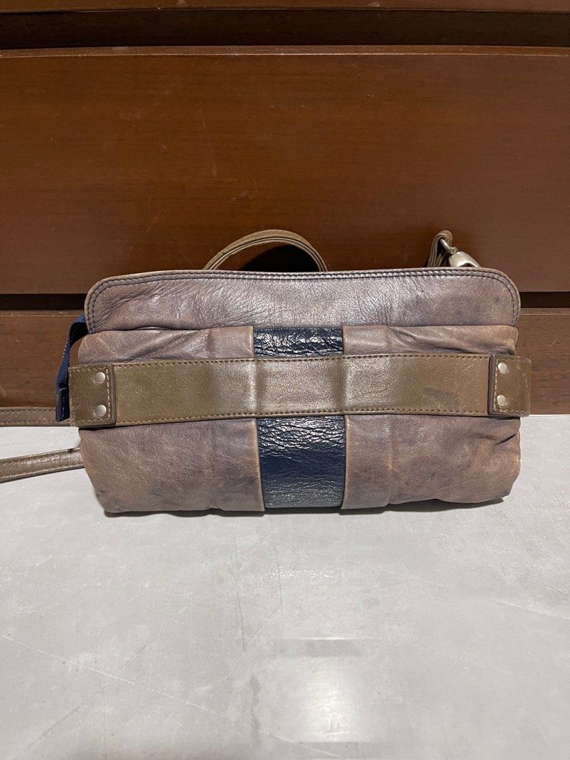 See By Chloe Leather Shoulder Bag (Category: Luxury Bags & Wallets) located in Bacnotan. Submitted by anosellmo (Listing ID 1413073899, Image 3). Description: - See By Chloe shoulder bag - Bronze color with navy blue accent - Long strap for shoulder or crossbody wear - Zipper closure - Small lock detail - Lined interior - Includes brand label.