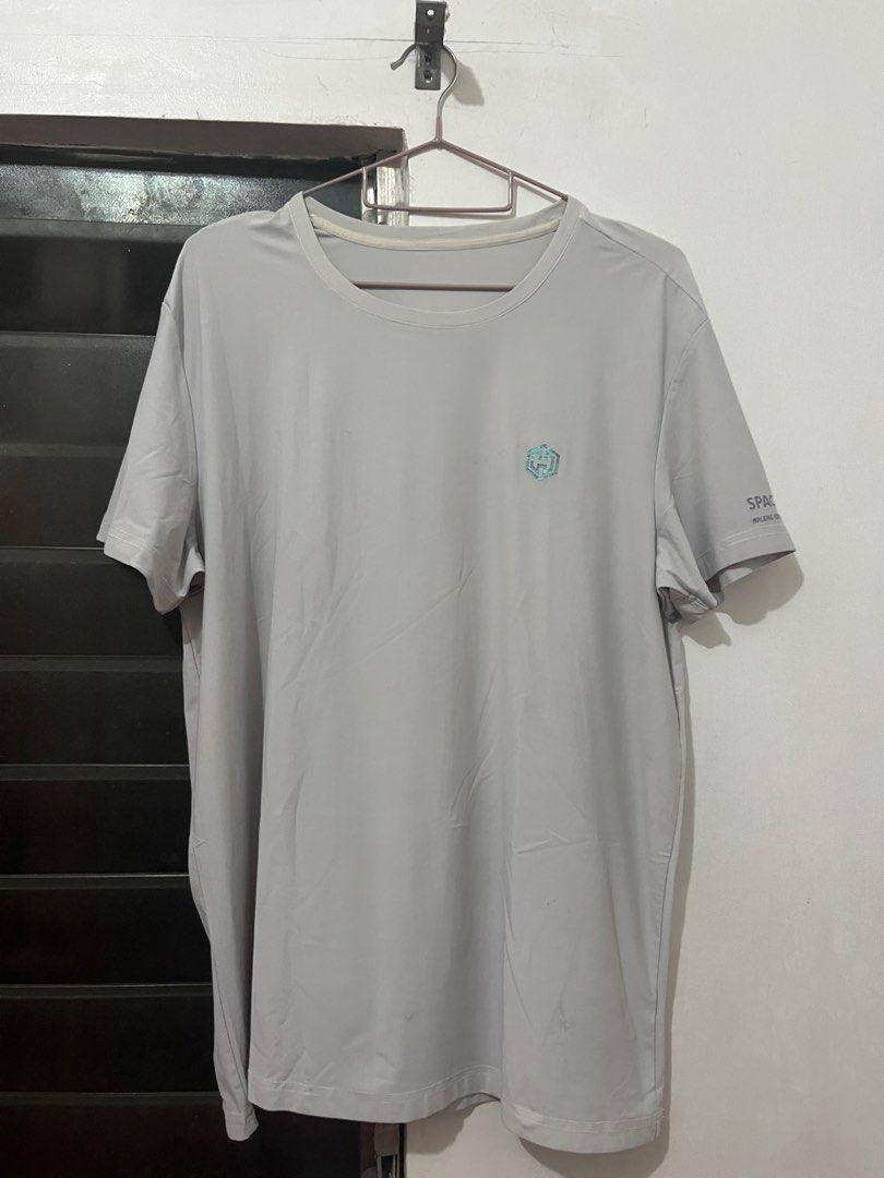Sport Gray T-shirt (Category: Tshirts & Polo Shirts ) located in Caloocan City. Submitted by rossmldp (Listing ID 1413038936, Image 1). Description: - Gray Space Sport T-shirt - Small logo on chest - Brand name printed on sleeve - Round neck - Short sleeves - Lightweight, athletic material - Solid gray color.