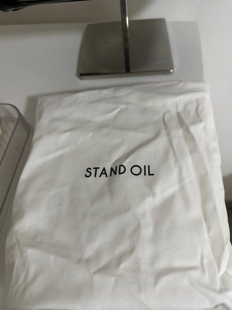 Stand Oil Boston Bag (Category: Luxury Bags & Wallets) located in Cavite. Submitted by luxedesign25 (Listing ID 1413067563, Image 2). Description: - Black Stand Oil Boston bag - Two front pockets - Top zipper closure - Two handles - Includes dust bag -authentic bag from korea.