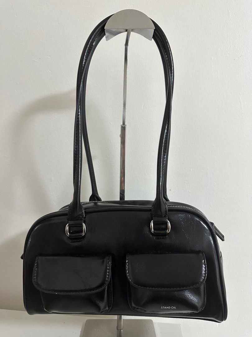 Stand Oil Boston Bag (Category: Luxury Bags & Wallets) located in Cavite. Submitted by luxedesign25 (Listing ID 1413067563, Image 1). Description: - Black Stand Oil Boston bag - Two front pockets - Top zipper closure - Two handles - Includes dust bag -authentic bag from korea.