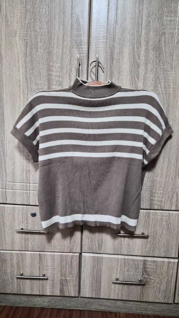Striped Crop Top (Category: Sleeveless) located in Bulacan. Submitted by getclaud (Listing ID 1413144569, Image 1). Description: Waffle top turtle neck Freesize but fits small to semi large Bought from Tiktok Available in Brown and Green (green with small stain in front) P150.00 - get 1 or P280 for both.