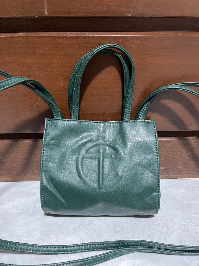 Telfar Shopping Bag Small Dark Green (Category: Luxury Bags & Wallets) located in Bacnotan. Submitted by anosellmo (Listing ID 1413073236, Image 2). Description: - Telfar Small Shopping Bag - Color: Dark Green - Features: - Top handle - Long strap (shoulder/crossbody) - Telfar logo - Interior: Branded tag.