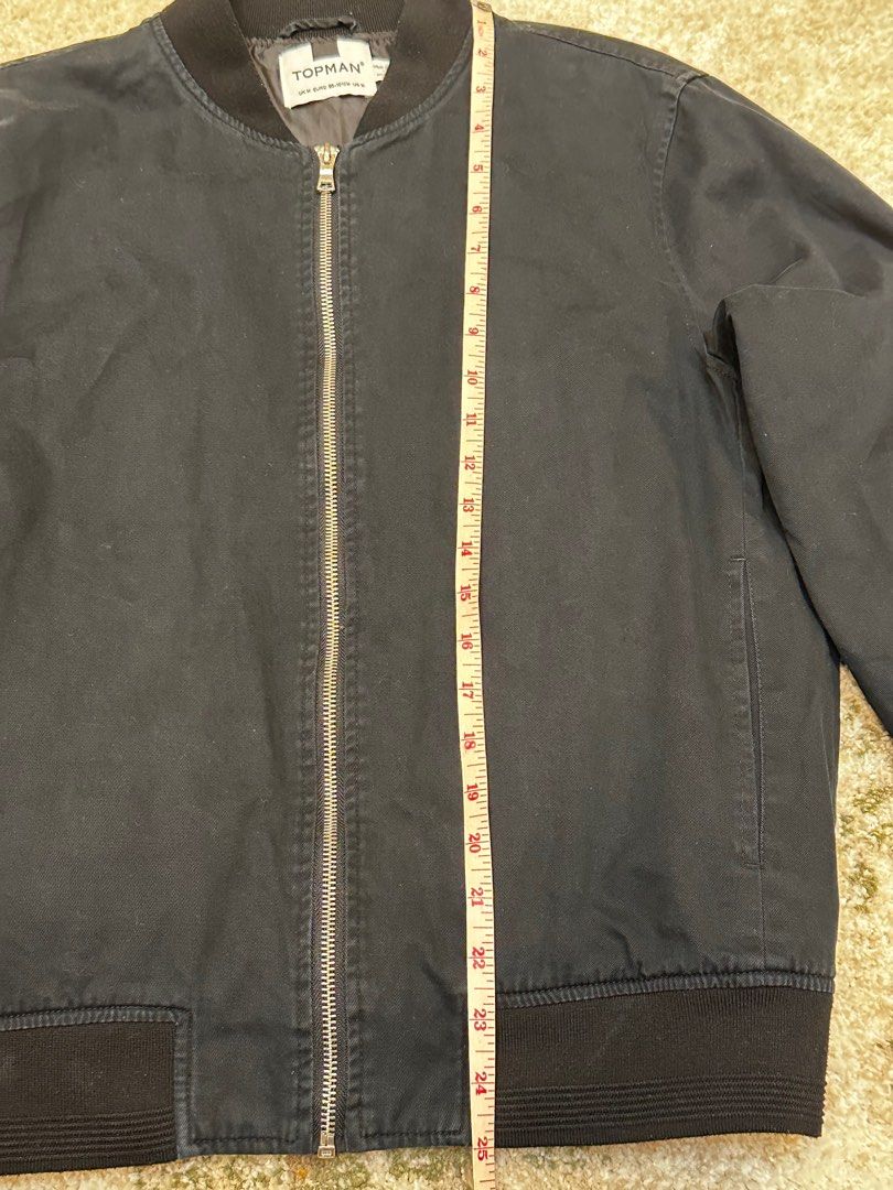 Topman Black Bomber Jacket (Category: Coats, Jackets and Outerwear) located in Manila. Submitted by karltrinidad (Listing ID 1413192002, Image 3). Description: - Topman black bomber jacket - Zip-up front - Ribbed collar, cuffs, and hem - Classic bomber style - Measurements in images - Versatile for various outfits.