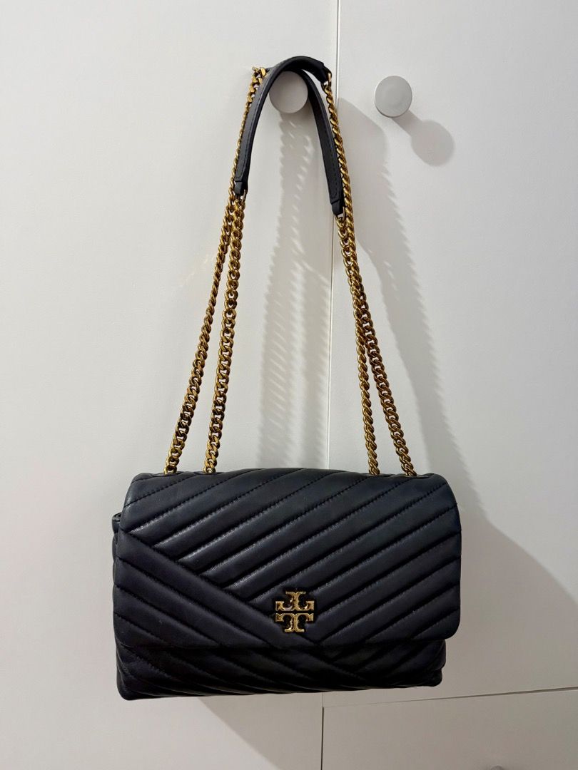 Tory Burch Black Quilted Shoulder Bag (Category: Luxury Bags & Wallets) located in Caloocan City. Submitted by claudiaccc1 (Listing ID 1413221830, Image 1). Description: Authentic Black quilted shoulder bag Gold-tone chain straps and hardware Shows some wear on hardware RFS decluttering Bought online.