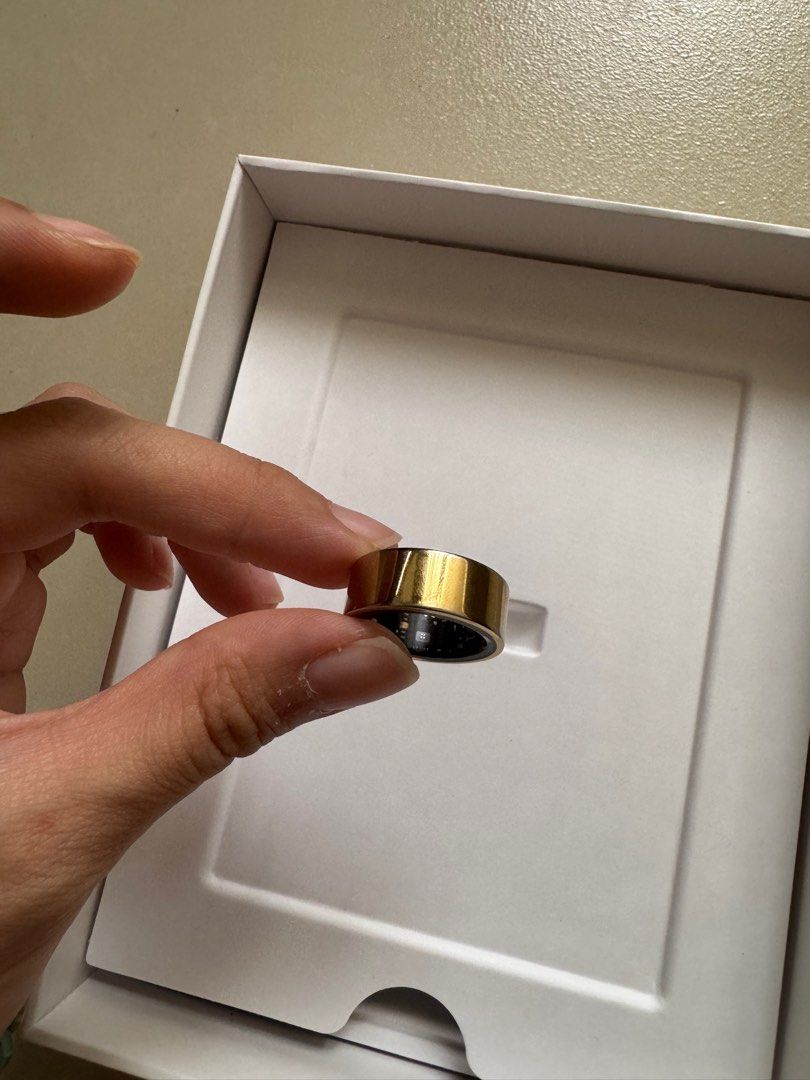 Ultrahuman Ring Air Bionic Gold (Size 6) (Category: Wearables & Smart Watches) located in Pasig City. Submitted by bnc511 (Listing ID 1413068234, Image 2). Description: - Ultrahuman Ring Air (Gold) - Size 6 - Bionic Gold - Smart ring for sleep, recovery, and movement tracking. - Includes original packaging, charger, and charging cord (USB C). Bought this mid-July 2025 so it’s around 5-6 months old. ‼️ Selling at more than 50% off given that it ha