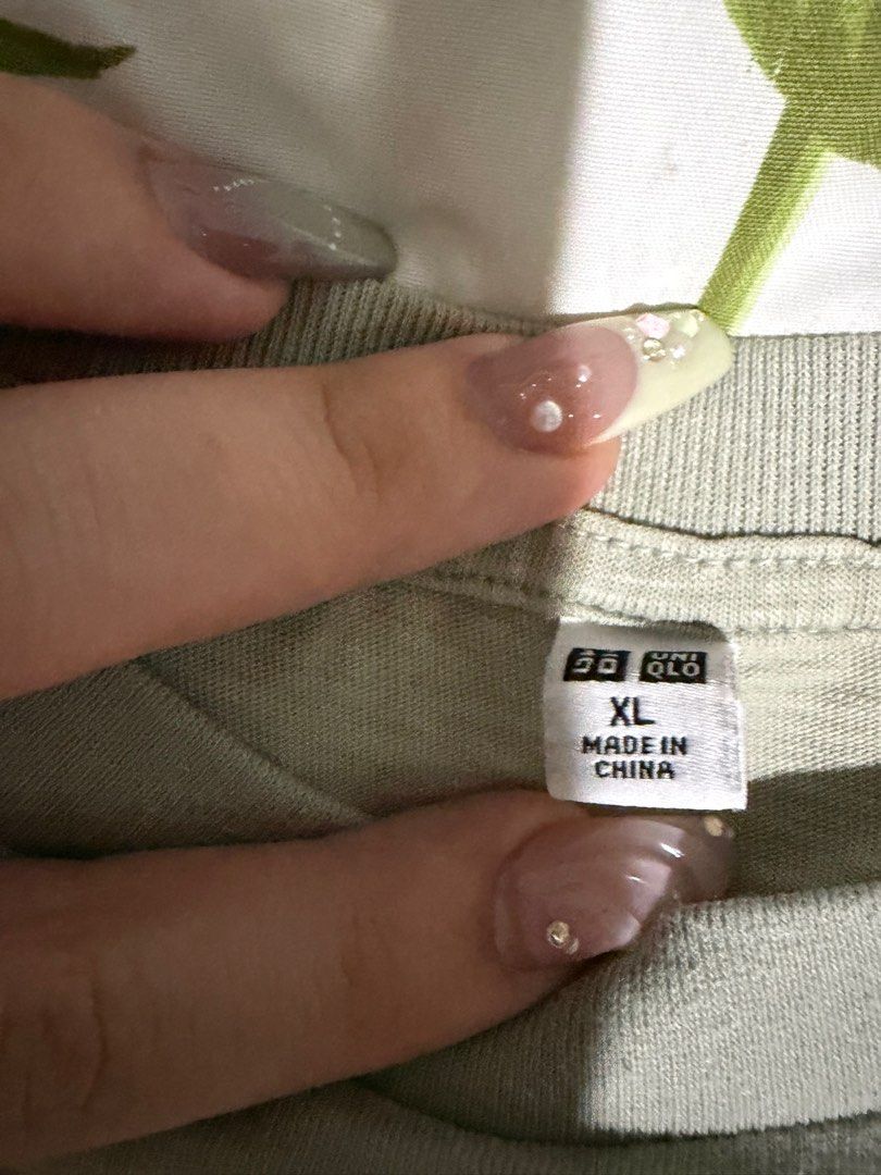 Uniqlo Light Green Crop Top (Category: Shirts) located in Dumaguete. Submitted by fuggler25 (Listing ID 1413170860, Image 3). Description: -SF paid by buyer MOP: BPI bank transfer, GCash, cash for meet-ups only.