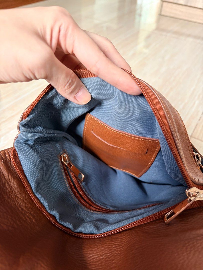 Vedasto Brown Genuine Leather Sling Bag (Category: Cross-body Bags) located in Taguig. Submitted by armih007 (Listing ID 1413063061, Image 3). Description: - unisex - brown genuine leather - with sign of usage but in good condition.