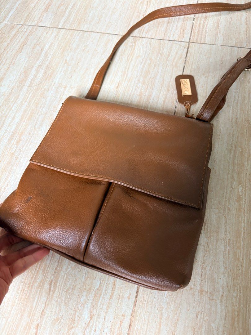 Vedasto Brown Genuine Leather Sling Bag (Category: Cross-body Bags) located in Taguig. Submitted by armih007 (Listing ID 1413063061, Image 1). Description: - unisex - brown genuine leather - with sign of usage but in good condition.