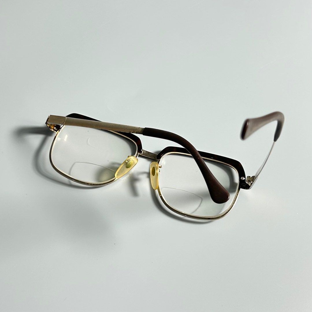 Vintage Tortoiseshell & Titanium Eyeglasses (Category: Sunglasses & Eyewear) located in Cavite. Submitted by datsoretro (Listing ID 1413213651, Image 2). Description: - Vintage Titan-P eyeglasses - Gold-tone frame with brown and tortoise shell accents - Bifocal lenses - Marked "Titan-P 54/17-145" - Made in Japan - Includes nose pads.