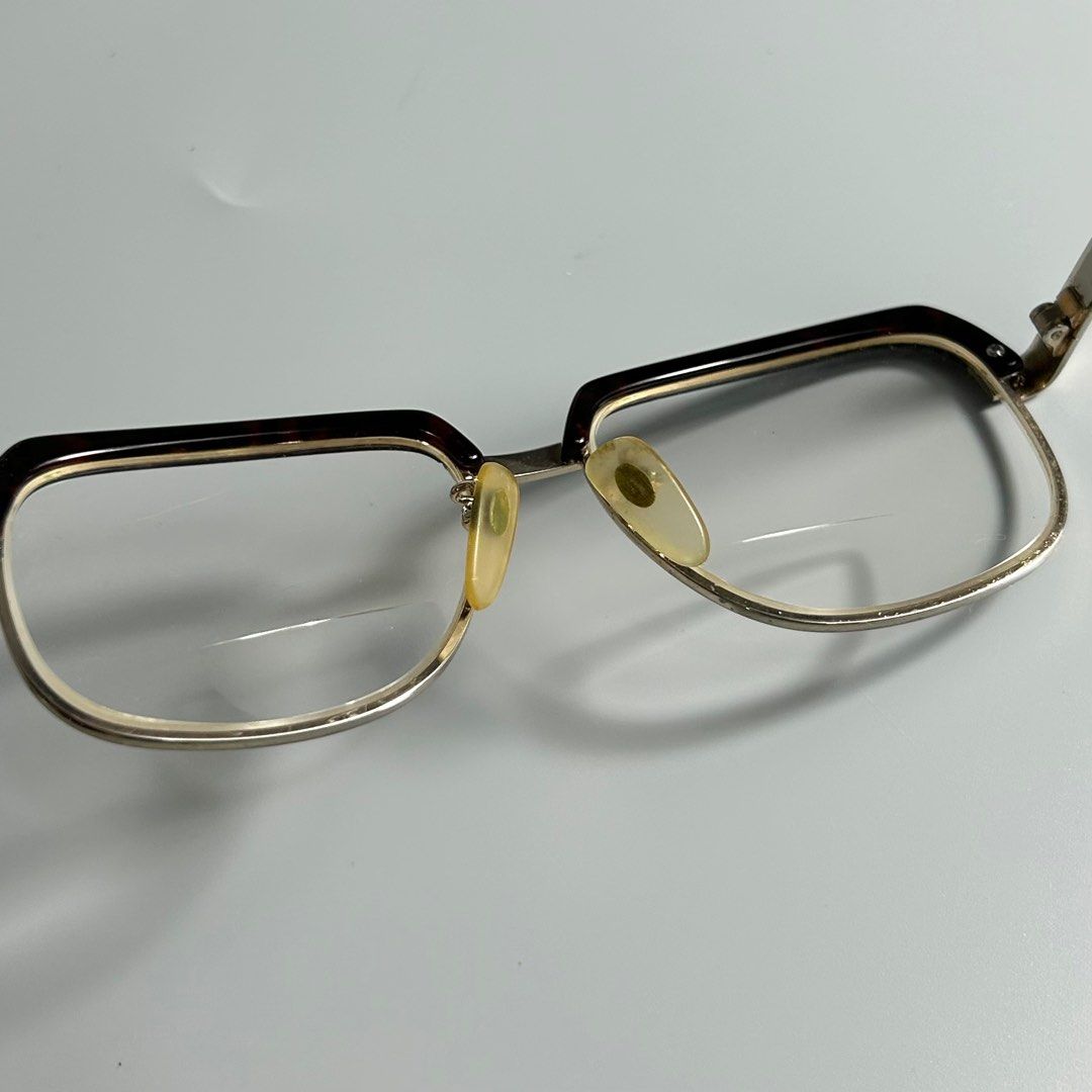 Vintage Tortoiseshell & Titanium Eyeglasses (Category: Sunglasses & Eyewear) located in Cavite. Submitted by datsoretro (Listing ID 1413213651, Image 3). Description: - Vintage Titan-P eyeglasses - Gold-tone frame with brown and tortoise shell accents - Bifocal lenses - Marked "Titan-P 54/17-145" - Made in Japan - Includes nose pads.