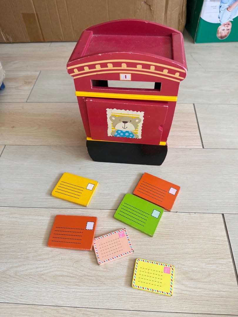 Wooden Mailbox Toy with Envelopes (Category: Educational & Learning Toys) located in Angono. Submitted by declutterWithKaye (Listing ID 1413085557, Image 2). Description: Wooden mailbox toy with bear design. Includes colorful envelopes (yellow, orange, green). Perfect for kids!.