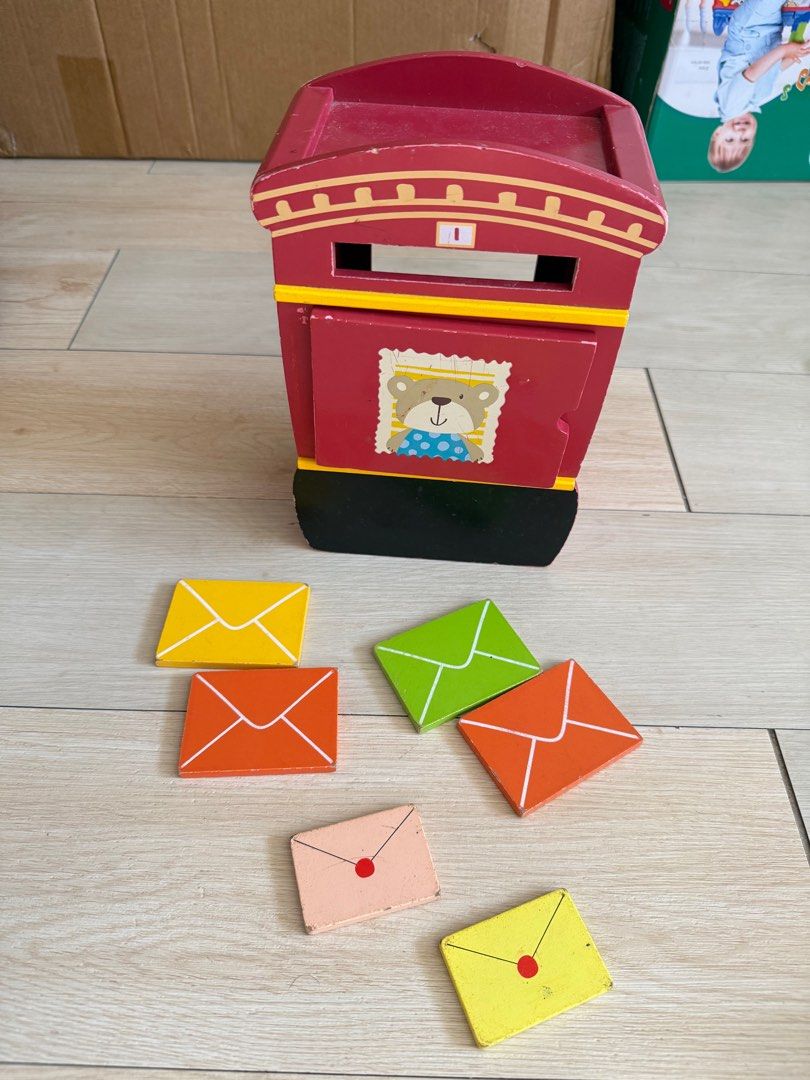 Wooden Mailbox Toy with Envelopes (Category: Educational & Learning Toys) located in Angono. Submitted by declutterWithKaye (Listing ID 1413085557, Image 1). Description: Wooden mailbox toy with bear design. Includes colorful envelopes (yellow, orange, green). Perfect for kids!.