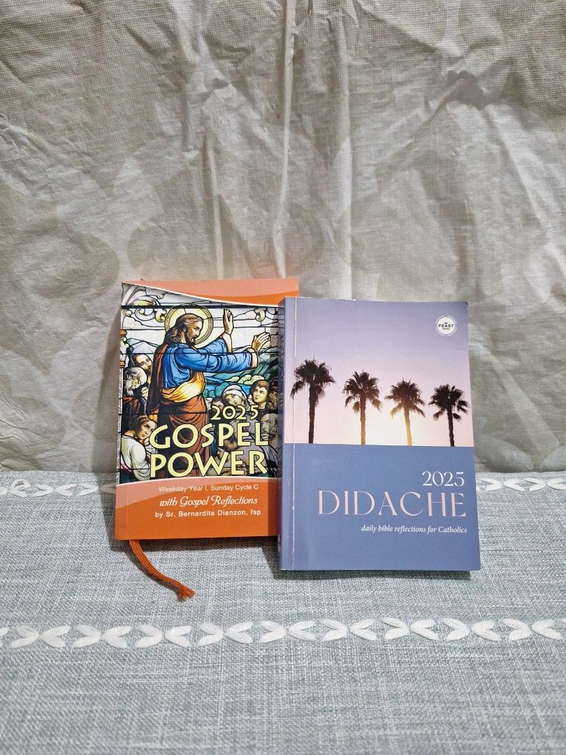 2025 Didache and Gospel Power Book bundle (Category: Religion Books) located in Naga. Submitted by bellebargainbox (Listing ID 1416656146, Image 1). Description: Two books are available: Didache 2025 and Gospel Power 2025. The Didache book has a cover with palm trees and the title. The Gospel Power book has a stained glass image on the cover. Both books are for the year 2025. The Gospel Power book has a bookmark..