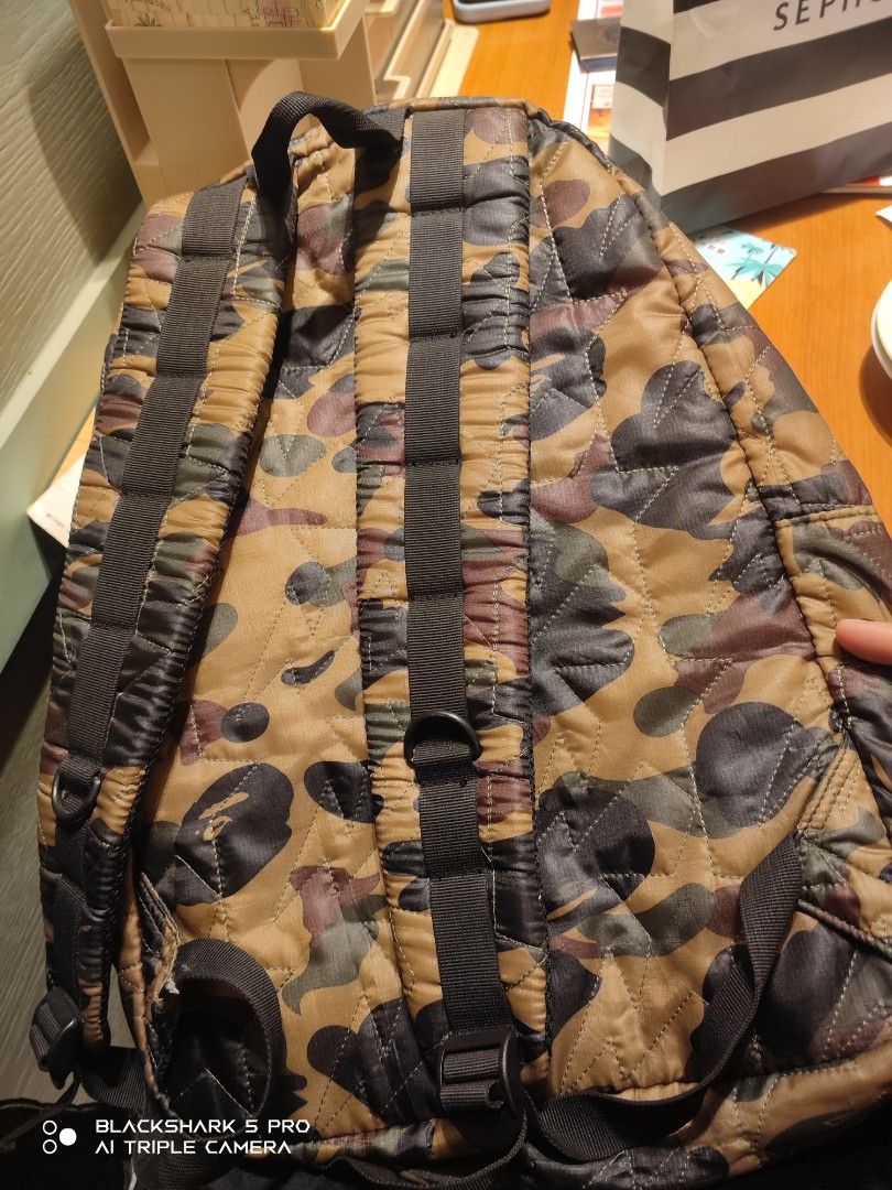 A Bathing Ape Camo Backpack (Category: Backpacks) located in Mandaluyong City. Submitted by human_crates (Listing ID 1416744160, Image 2). Description: - off / Legit A Bathing Ape backpack - Unique camo pattern - Front zip pocket - Padded shoulder straps for comfort - Orange interior lining - A Bathing Ape logo tag - Padded back straps.
