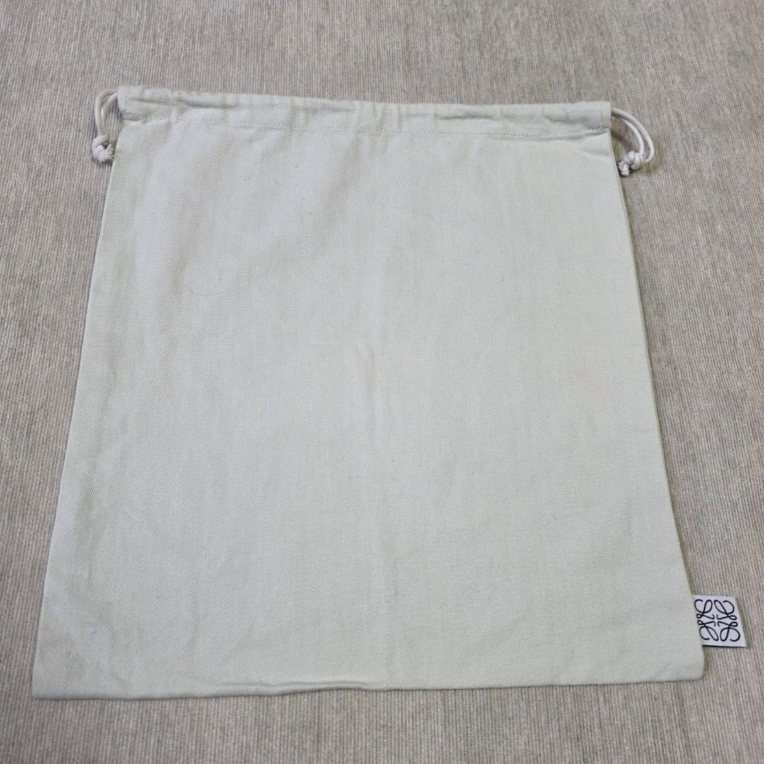 Authentic Loewe dust bag 14x12.5 inches (Category: Cross-body Bags) located in Manila. Submitted by jfluxury.co (Listing ID 1416831706, Image 2). Description: excellent condition like new no flaws bought in Japan 🇯🇵 💯% Authentic. 😊 Money back guarantee. 😊 Clean and ready to use na.