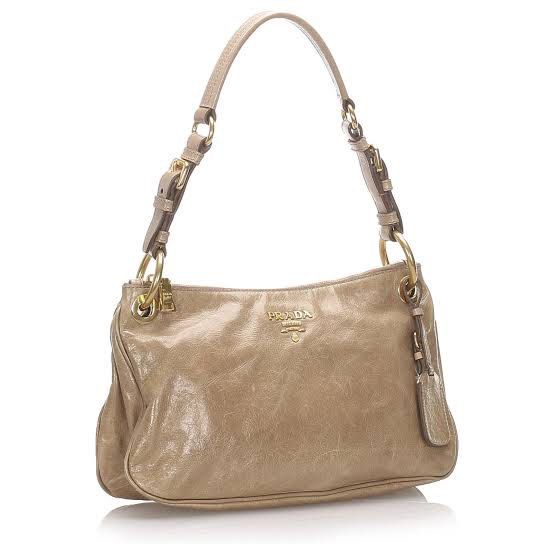 Authentic PRADA Vitello Shine Baguette Shoulder Bag (Category: Luxury Bags & Wallets) located in Malolos. Submitted by theroyalrunwayph (Listing ID 1416782601, Image 1). Description: Authentic. White tag still intact. Minor flaws on hardware. Very pretty. Classy and pretty color..