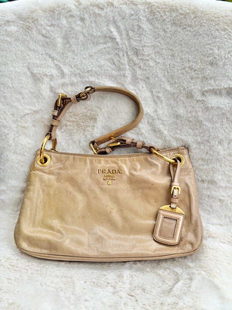 Authentic PRADA Vitello Shine Baguette Shoulder Bag (Category: Luxury Bags & Wallets) located in Malolos. Submitted by theroyalrunwayph (Listing ID 1416782601, Image 2). Description: Authentic. White tag still intact. Minor flaws on hardware. Very pretty. Classy and pretty color..