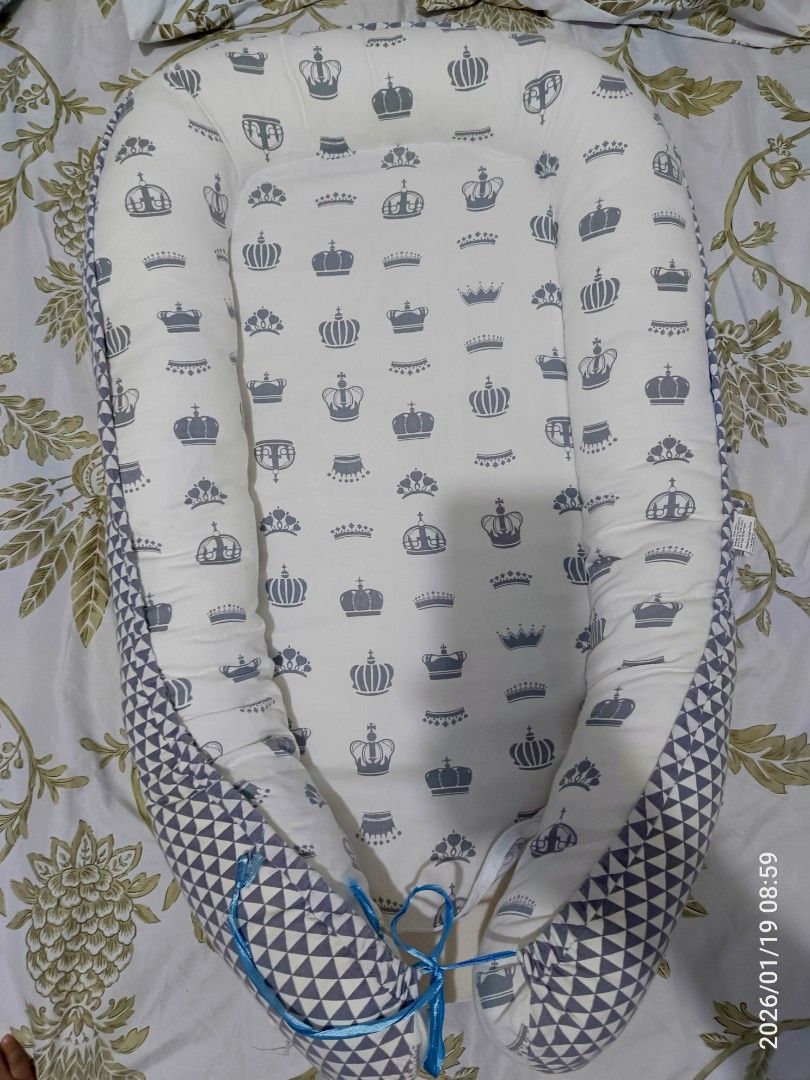 Baby Bed/baby nest (Category: Cots & Cribs) located in Taguig. Submitted by thebelgas (Listing ID 1416753287, Image 1). Description: Preloved baby bed/baby nest Washable po ito at reversible. Issue: Nasira zipper sa baba at pinalitan na yung tali. RFS: Decluttering.