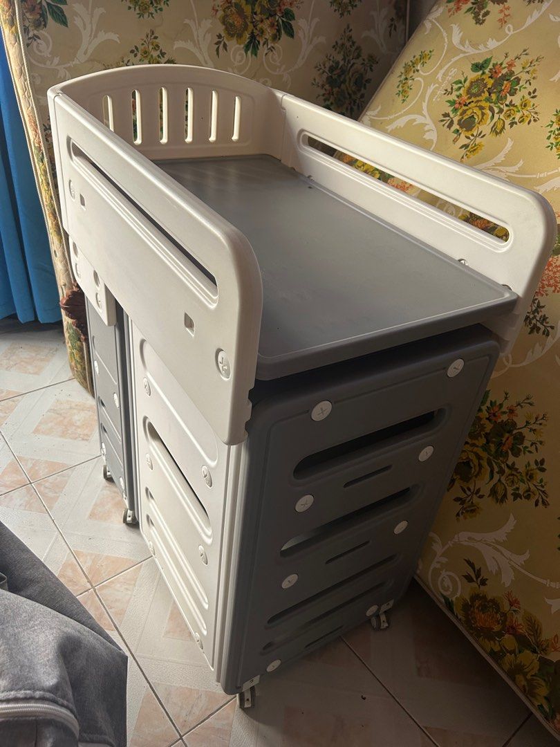 Baby Changing Table with wash basin (Category: Changing Mats & Accessories) located in Cabanatuan. Submitted by krnlim (Listing ID 1416772785, Image 1). Description: - Changing surface with raised edges for safety - Multiple drawers for storage - Mounted on wheels for easy movement - With wash basin - Neutral color scheme RFS : not using anymore.