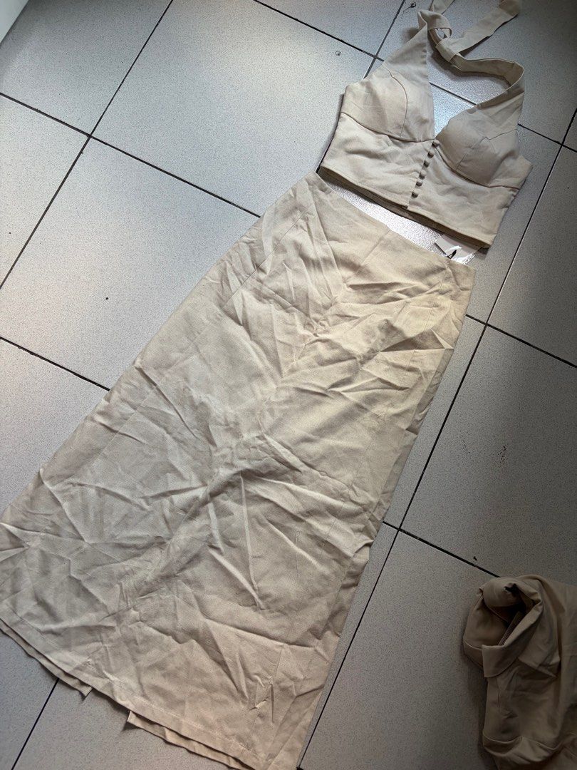 Beige Halter Top and Skirt Set (Category: Sets or Coordinates) located in Manila. Submitted by bndthetrnd (Listing ID 1416709715, Image 1). Description: - Beige two-piece set - Halter top with button details - Matching midi skirt - Fitted top, straight skirt - Lightweight fabric - Suitable for warm weather - Neutral color 500 top 500 skirt.