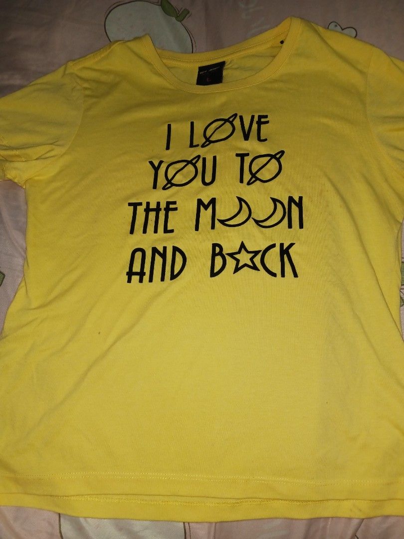 BNY Jeans Yellow Graphic Tee - Large (Category: Tshirts & Polo Shirts ) located in Naga. Submitted by havenaid (Listing ID 1416783435, Image 2). Description: Bright yellow graphic tee with a cute “I love you to the moon and back” print. The color is still vibrant and the shirt is structurally okay despite its age. Please note: this is an older shirt and has visible stains. I’m not sure if the stains are washable, so selling as-is. Still good for 