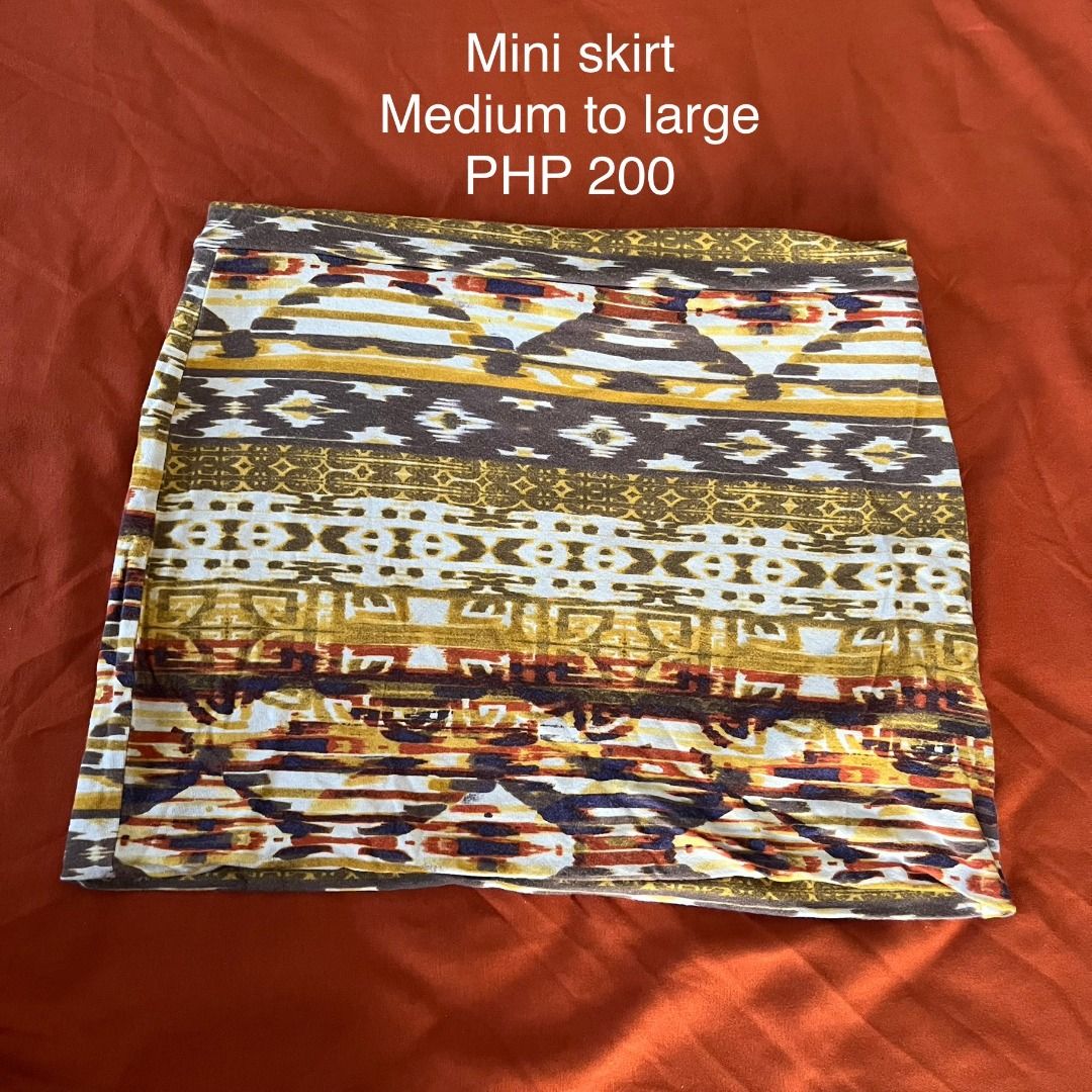 Boho Design Mini Skirt - Medium to Large (Category: Skirts) located in General Luna. Submitted by vstesing (Listing ID 1416727012, Image 1). Description: - Stylish mini skirt, stretchy - Unique patterned design - Fits medium to large sizes - Features brown, yellow, and white colors - Perfect for casual wear.