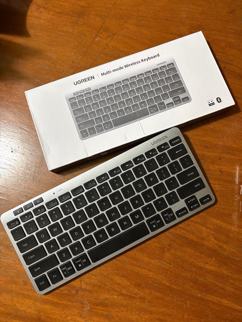 BRAND NEW UGREEN Multi-mode Wireless Keyboard (Category: Computer Keyboard) located in Paranaque City. Submitted by katricesison (Listing ID 1416721433, Image 2). Description: - Bought it for ₱850 - Never been used - UGREEN multi-mode wireless keyboard - Compact and portable design - Standard QWERTY layout with function keys - Includes the original box.