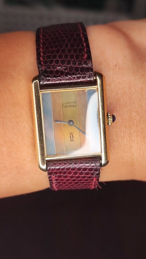 Cartier Tank Must Watch (Category: Luxury Watches) located in Cebu City. Submitted by petegohan (Listing ID 1416713449, Image 3). Description: Cartier Tank Must vermiel solid sterling silver case plated with gold rare iconic cartier Tri-color "trinity" dial, immaculate almost perfectly new dial -blued hands -original burgundy strap still preserved well -Free aftermarket 3rd party black strap with butterfly clasp - Cabochon crown intact aside from