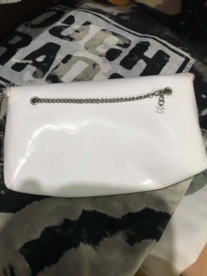 Chanel White Pink Chain mini Bag (Category: Luxury Bags & Wallets) located in Caloocan City. Submitted by mermaid.drive (Listing ID 1416802252, Image 2). Description: - Pink accents - Pink fuzzy interior - Chain strap - Magnetic snap closure - Chanel logo visible - Approximate dimensions: 6" length x 4" height.