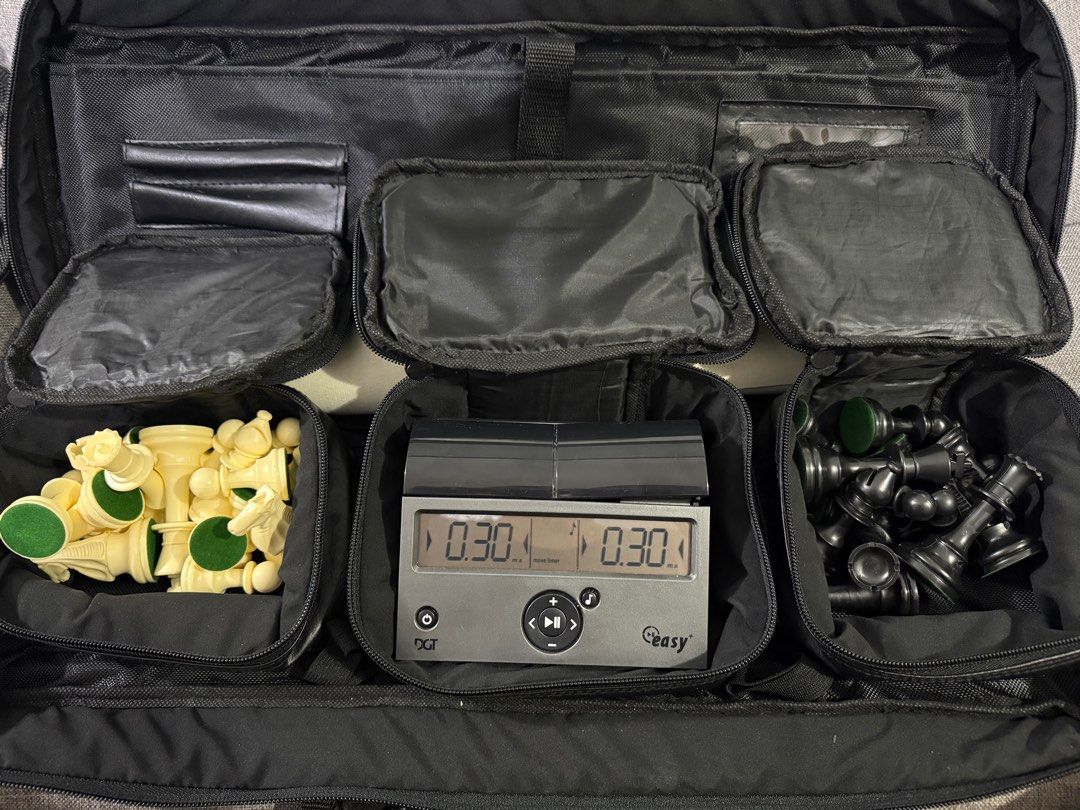 Chess Set (Category: Board Games & Puzzles) located in Quezon City. Submitted by gritxfaith (Listing ID 1416792973, Image 1). Description: Eureka Chess mat and pieces with nylon bag - 500 Add synthetic leather bag - 250 (with little damage on the cover) Add dgt chess clock - 1500.