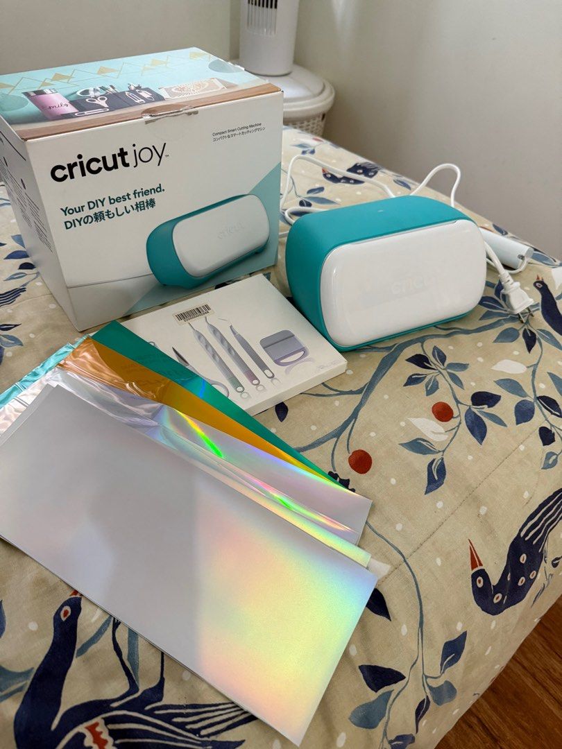Cricut Joy Compact Cutting Machine (Category: Craft Supplies & Tools) located in San Pedro. Submitted by dhaest (Listing ID 1416647502, Image 2). Description: - Cricut Joy compact cutting machine (teal and white) - Includes tools and various vinyl sheets - Great for DIY projects and crafts RFS: declutter - last price na po..