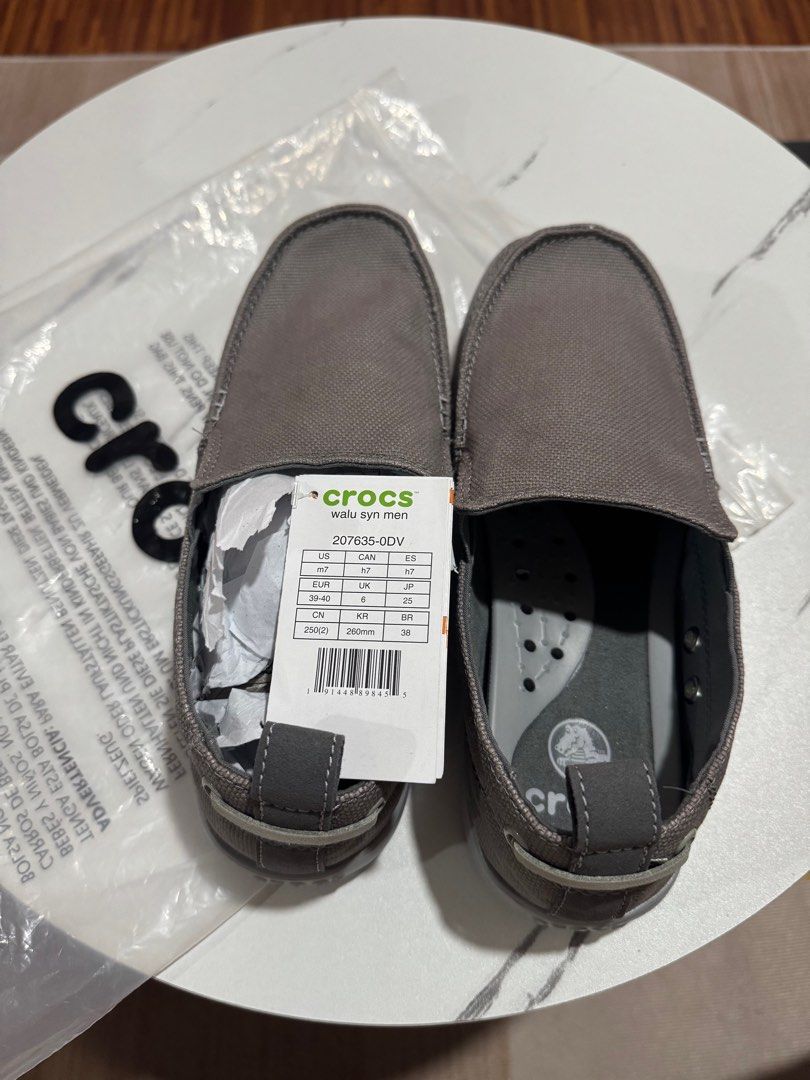 Crocs Walu Syn Men's Shoes (Category: Casual Shoes) located in Manila. Submitted by elegancemnl (Listing ID 1416809045, Image 1). Description: - Brand new Crocs Walu Syn men's shoes - Color: Gray - Size: US M7, UK 6, EUR 39-40, 250mm - Comes with original tag - Never been worn - Features textured soles for enhanced grip - Includes original packaging - original price: 4,700 ❌.