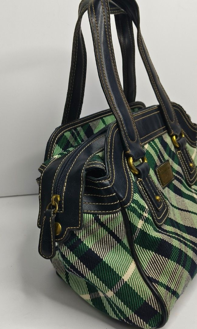 E-Land University Classic Hand Bag (Category: Luxury Bags & Wallets) located in Baguio. Submitted by PreiLoveMaria (Listing ID 1416827393, Image 3). Description: Classic Eland Univ Plaid Handbag Capture that British college style with this unique satchel! This Eland Univ bag features a stylish green and navy plaid canvas body with navy leather trim and sturdy top handles. Perfect for everyday use. Condition: Good used condition, well-maintained w