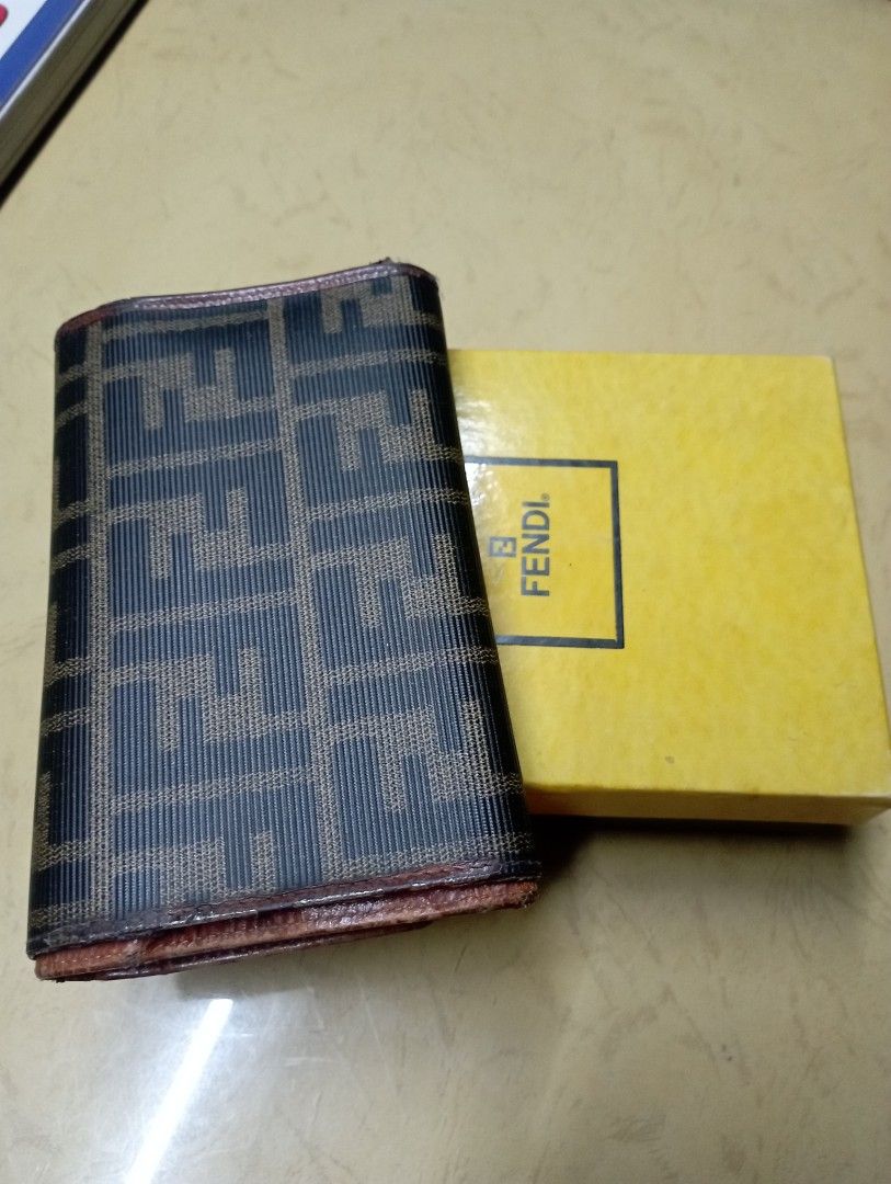 Fendi Wallet with Box (Category: Luxury Bags & Wallets) located in Meycauayan. Submitted by issasvillaflores (Listing ID 1416789580, Image 3). Description: - Authentic Fendi wallet - Iconic FF logo pattern - Includes original box - Multiple card slots and cash compartments - Secure snap closure - Stylish brown and black exterior - Luxurious brown leather interior -Pre loved/ bought in Italy.