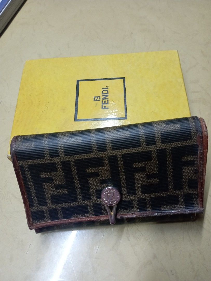 Fendi Wallet with Box (Category: Luxury Bags & Wallets) located in Meycauayan. Submitted by issasvillaflores (Listing ID 1416789580, Image 2). Description: - Authentic Fendi wallet - Iconic FF logo pattern - Includes original box - Multiple card slots and cash compartments - Secure snap closure - Stylish brown and black exterior - Luxurious brown leather interior -Pre loved/ bought in Italy.