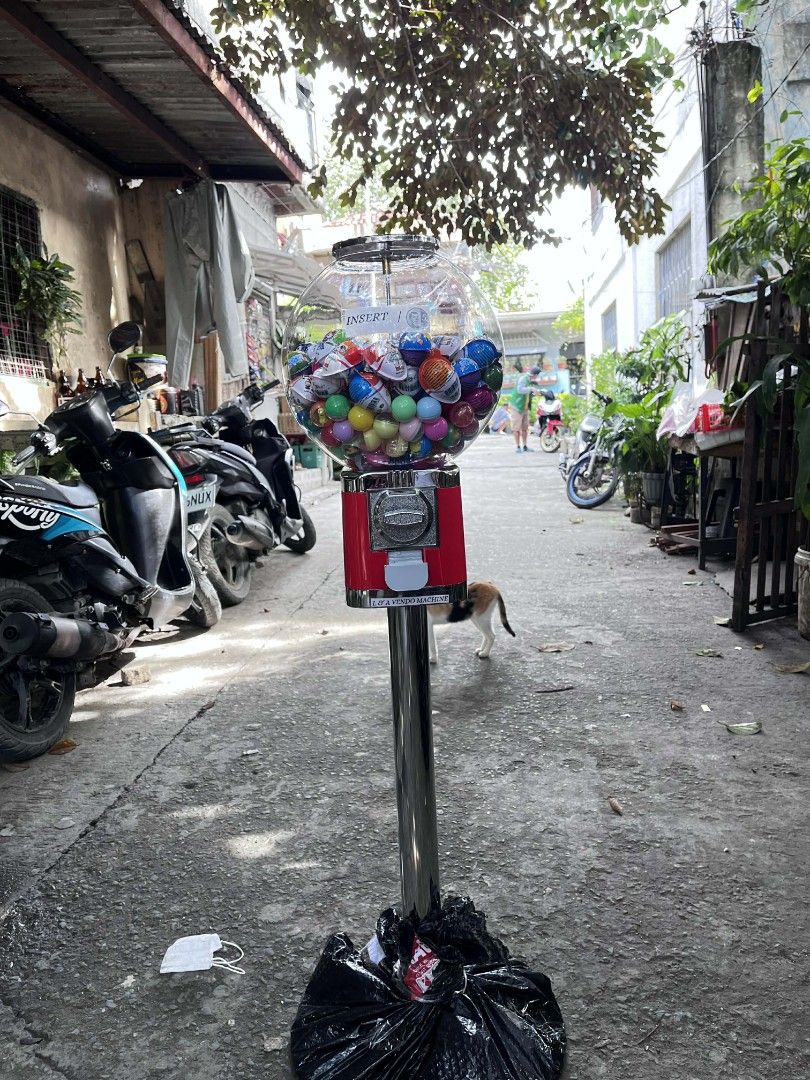 Gumball Machine with Stand (Category: Coffee Machines & Makers) located in Manila. Submitted by leosibalon50828 (Listing ID 1416668475, Image 1). Description: I sell brand new single head candy machine - Gumball machine with included gumballs. - Features a clear globe. - Red dispensing unit. - Sturdy chrome stand. - Ideal for home or small business use..