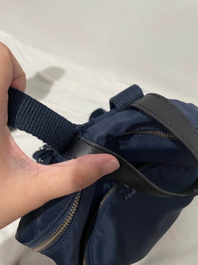Kipling Navy Blue Backpack (Category: Backpacks) located in Manila. Submitted by reloom (Listing ID 1416760150, Image 2). Description: - Navy blue Kipling backpack - Main compartment with zipper closure - Front pocket with zipper closure - back pocket with zipper closure - Top handle - Includes Kipling monkey keychain - Straps show some wear (see picture) - Perfect for everyday use.