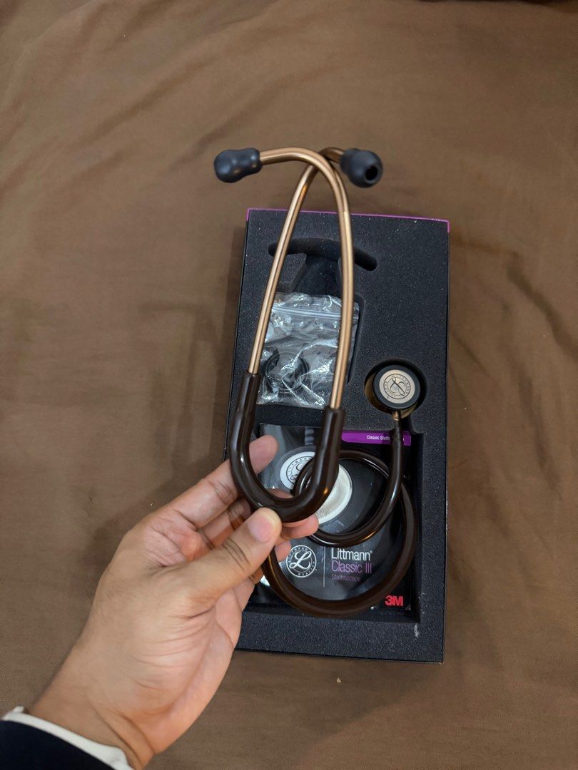 Littmann Classic III Stethoscope (Category: Medical Supplies & Tools) located in Manila. Submitted by pbenson_c (Listing ID 1416682992, Image 3). Description: - Used- Like New Littmann Classic III stethoscope. - Elegant brown and bronze color. - Comes with original box and all accessories. - Includes extra ear tips. - Features the Littmann logo on the chestpiece. - Used but in pristine condition..