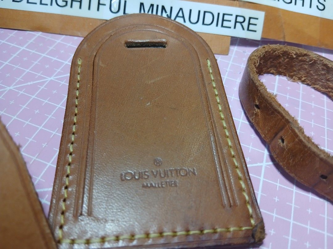 Louis Vuitton Luggage Tag with Strap (Category: Luxury Bags & Wallets) located in San Pedro. Submitted by whatandeverdelights (Listing ID 1416642060, Image 3). Description: - Authentic Louis Vuitton luggage tag - Includes strap with buckle and longer strap - Features Louis Vuitton logo and "Made in France" stamp - Leather shows some wear - Adds a touch of luxury to your luggage - All sales final.