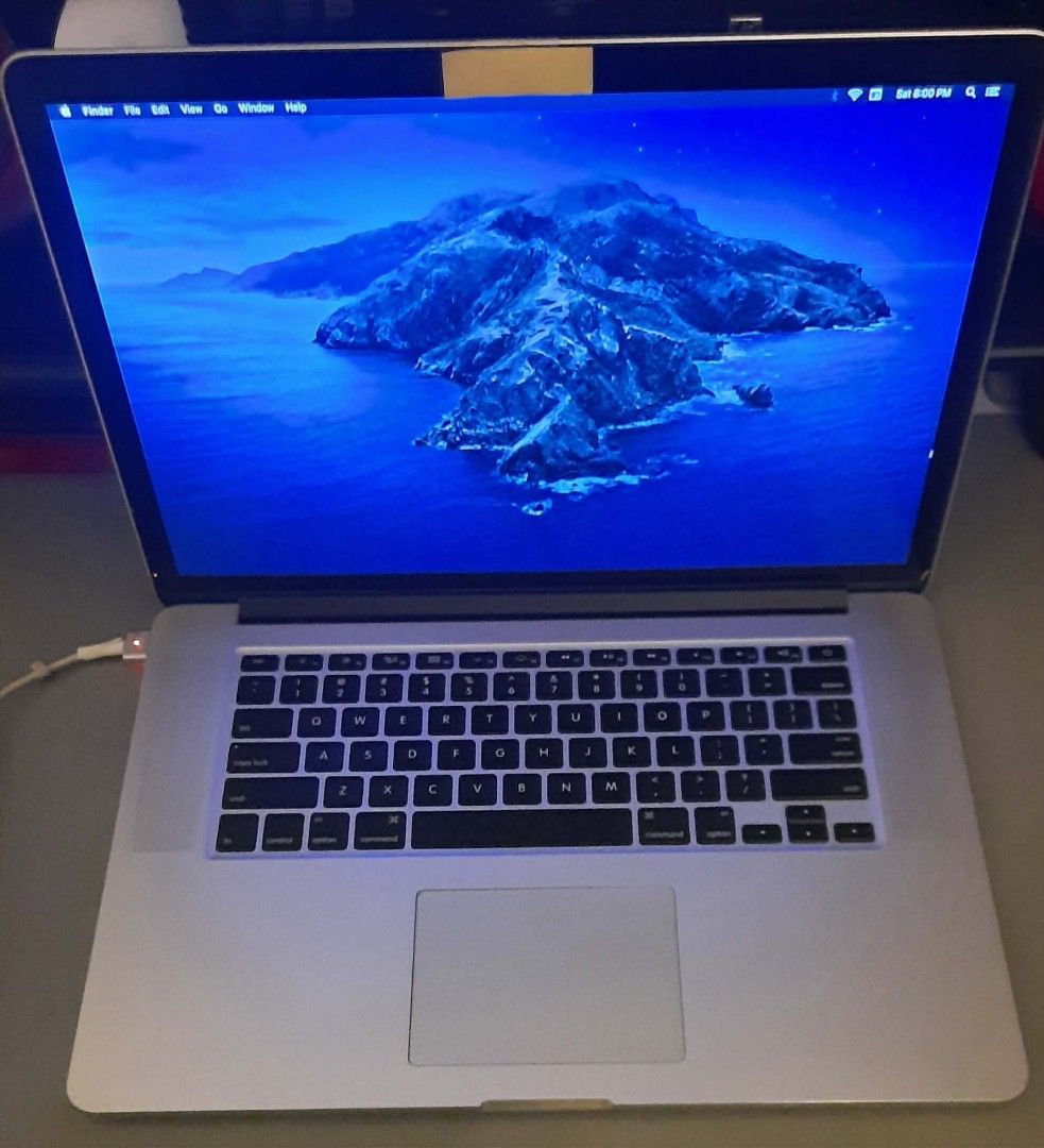 MacBook Pro (Retina, 15-inch, Mid 2015) (Category: Laptops & Notebooks) located in Las Pinas. Submitted by younggem.d97325 (Listing ID 1416695710, Image 3). Description: MacBook Pro with a 15-inch Retina display. It runs on macOS Catalina. Features a 2.2 GHz Quad-Core Intel Core i7 processor, 16 GB of memory, and Intel Iris Pro 1536 MB graphics. The serial number is C02QR7G9G8WN. The model identifier is MacBookPro11,4. Issue: No Battery (Needs to