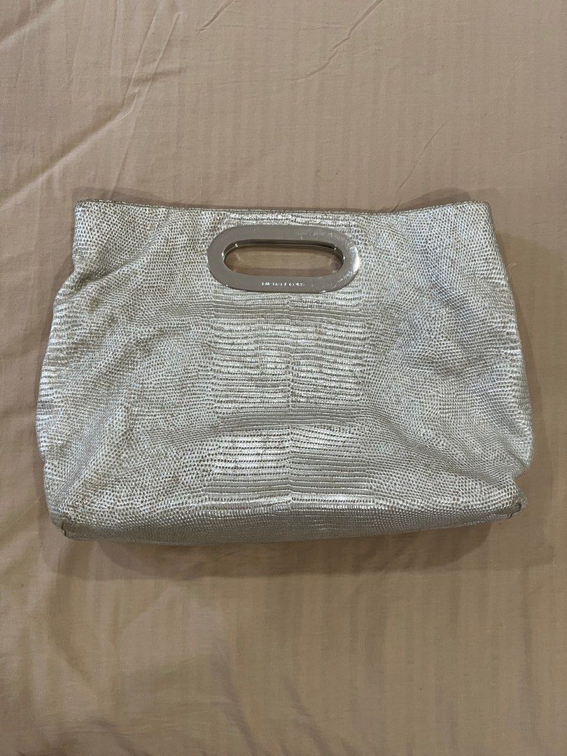 Michael Kors Metallic Berkley Clutch Bag (Category: Luxury Bags & Wallets) located in Cotabato. Submitted by nacreous (Listing ID 1416686549, Image 2). Description: Condition: 8/10 DESCRIPTION: ➤ Original pre-loved item ➤ Beautiful interior ➤ RFS: Decluttering FEATURES: Exterior ➤ Textured Leather ➤ Silver hardware ➤ Height: 11.5 in / 29.5 cm ➤ Height when folded: 7.5 in / 20 cm ➤ Width: 15.5 in / 39.5 cm ➤ Depth: 4 in / 10 cm Interior ➤ Two magn